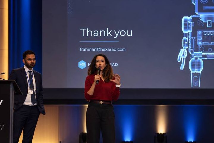 Dr Farzana Rahman presenting on stage at a health innovation summit