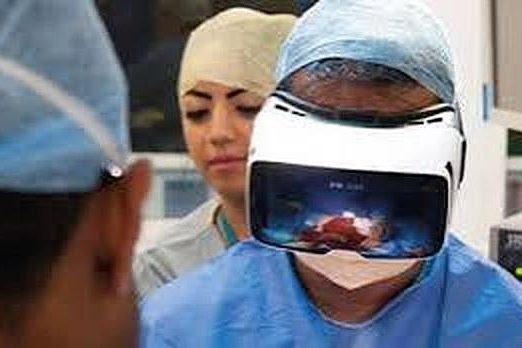 Professor Shafi Ahmed using VR surgical technology in theatre